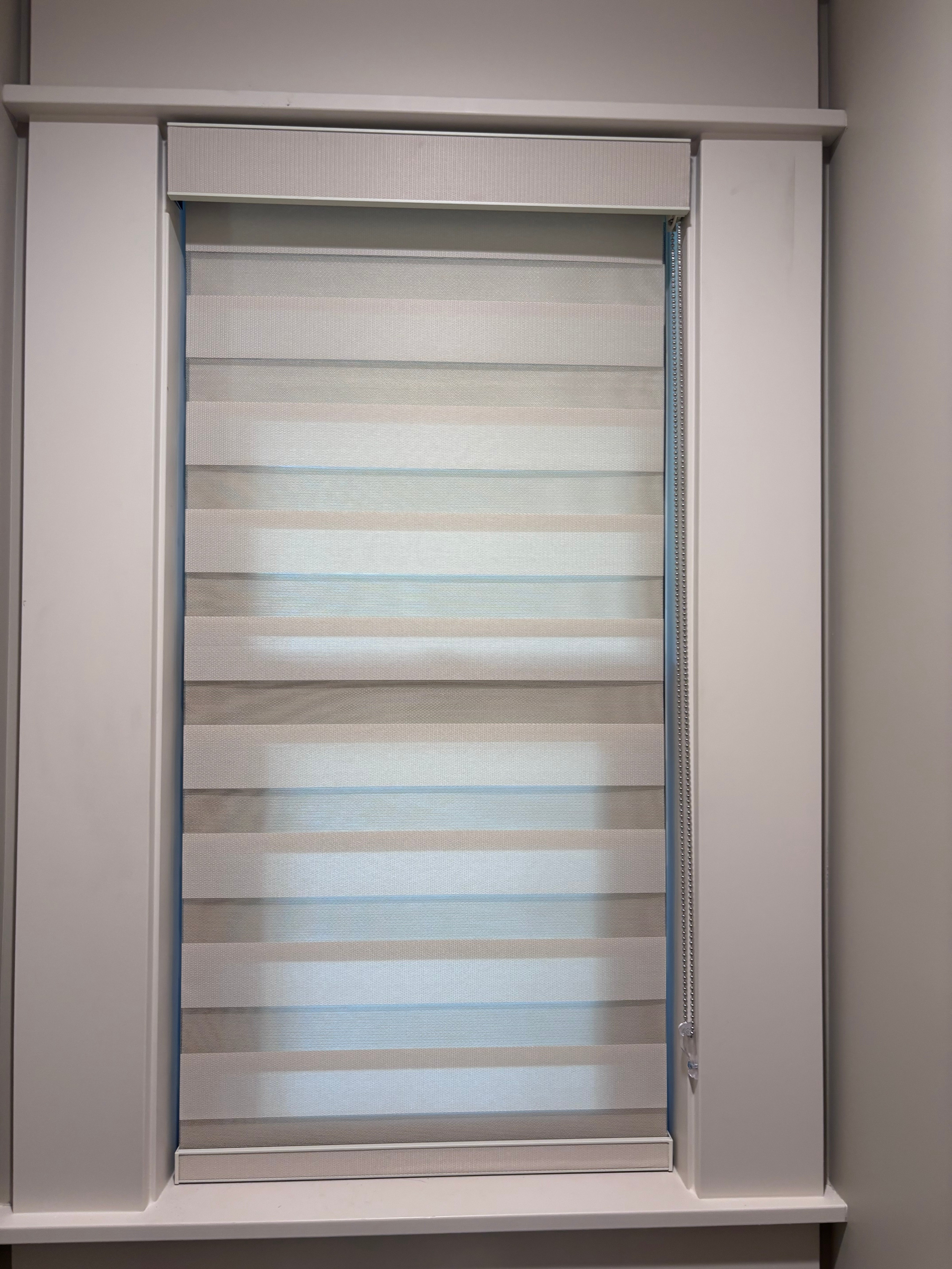 White custom zebra roller shades professionally installed in a North Pasadena home.