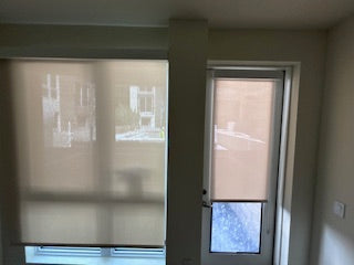 Motorized light-filtering shade lowering for daytime privacy
