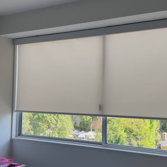 Motorized light-filtering roller shade opening to soften natural light